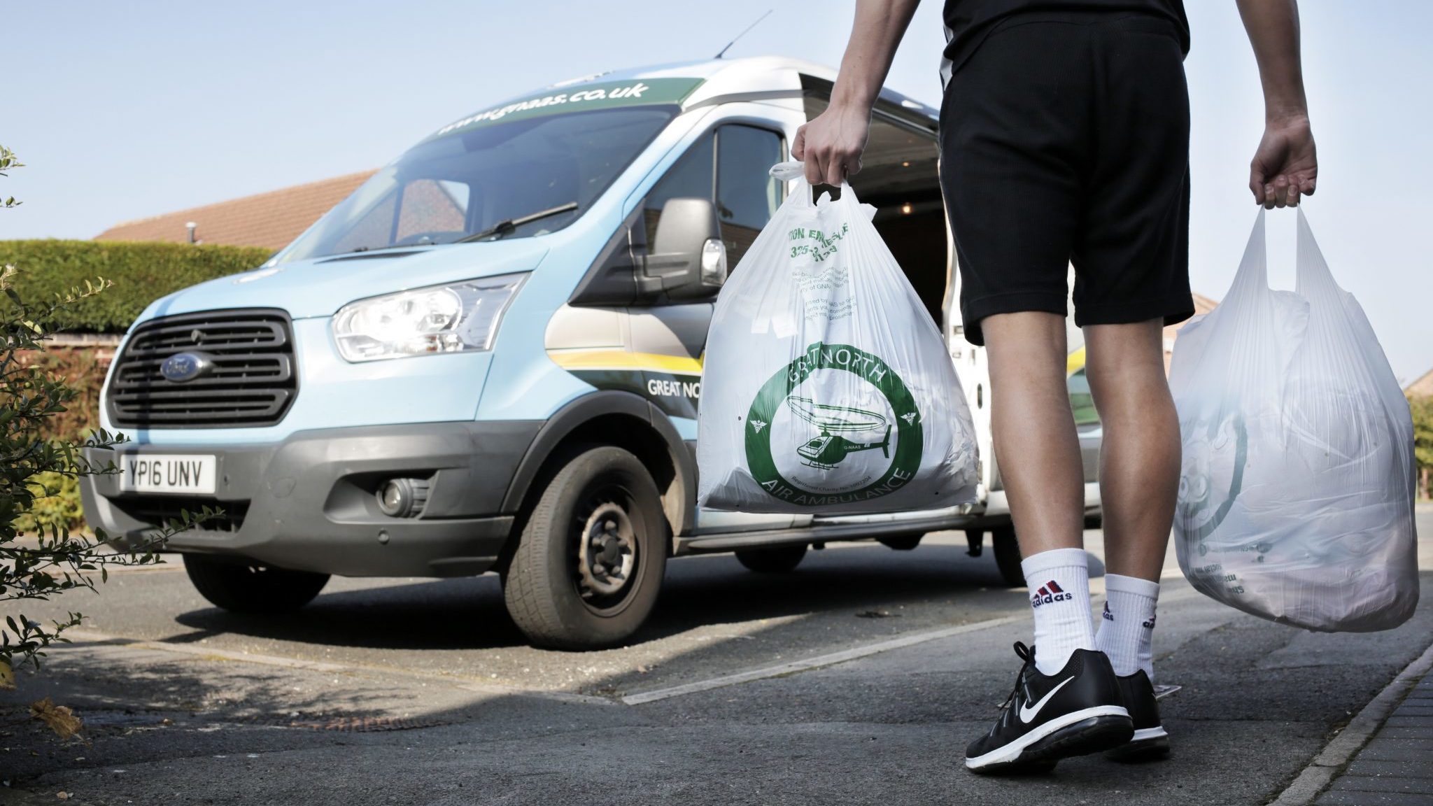 GNAAS Member collecting a clothing donation from a home